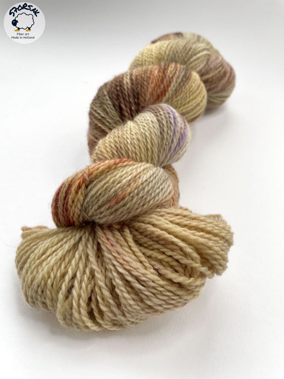 Hand dyed sock weight yarn. Superwash Merino, nylon and stellina glitter. 'Muad’dib’.