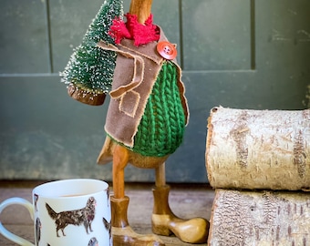 Papa (the Christmas tree carrying wooden duck) bamboo duck with boots, Christmas tree, wax jacket, tweed flat cap & scarf. Collect the tree.