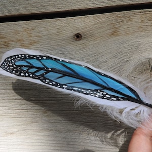 Painted feather, blue monarch butterfly