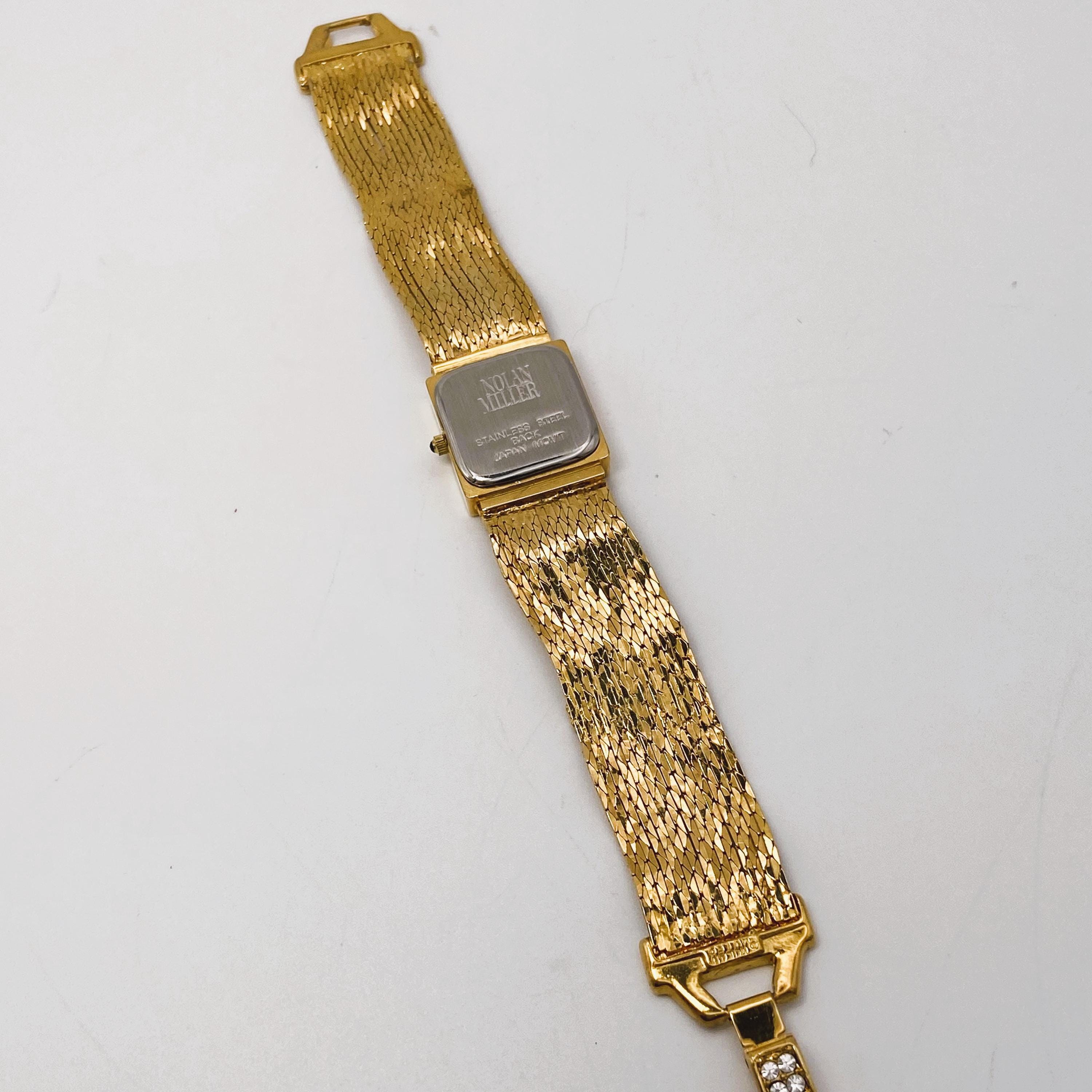 Ladies vintage watch by Nolan Miller. Gold tone with sparkly stones. Vintage Nolan Miller Goldtone Quartz Watch with White  main image 2