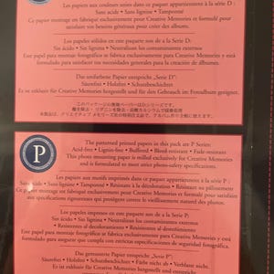 May include: Two sheets of photo mounting paper with text in multiple languages. The top sheet has a blue "D" logo, and the bottom sheet has a blue "P" logo. The paper is acid-free, lignin-free, and buffered.