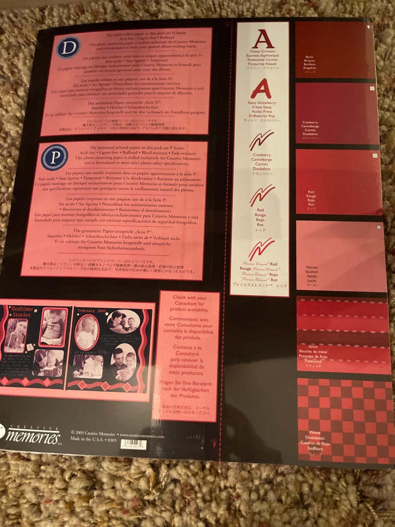 May include: A Creative Memories scrapbook paper pack featuring various shades of red and pink. The pack includes color swatches, text, and sample photos. The paper is designed for scrapbooking and photo preservation.