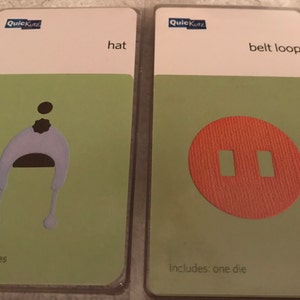May include: Two die cut cards. The first card has a white background with the word "hat" and a light green background with a white hat die cut. The second card has a white background with the words "belt loop" and a light green background with an orange belt loop die cut.