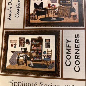 May include: A quilt pattern booklet with two illustrations of cozy living rooms. The booklet is titled "Comfy Corners" and is part of the "Appliqué Series 129" by "Joan's Own Creations".