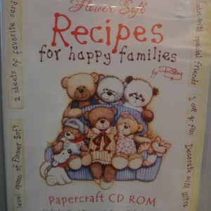 May include: A package for a Papercraft CD ROM with the title "Recipes for happy families" featuring illustrations of teddy bears. The package includes card topper and paper tole designs, backing papers, and more. The text "A Sprinkle of Imagination" is also visible.