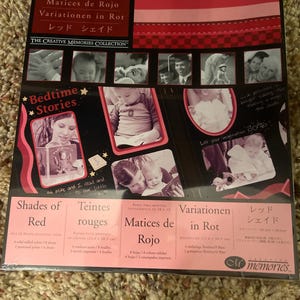 May include: A package of photo mounting paper titled "Shades of Red" with the text "Bedtime Stories." The package features a collage of baby photos and is from "The Creative Memories Collection."