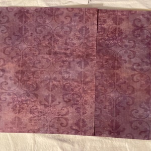 May include: Two sheets of purple patterned paper with a subtle distressed look. The pattern is a repeating floral design.