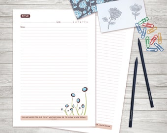 May include: A printable lined journal page with a quote by C.S. Lewis: "You are never too old to set another goal or to dream a new dream." The page has a simple floral design with blue flowers and green stems.