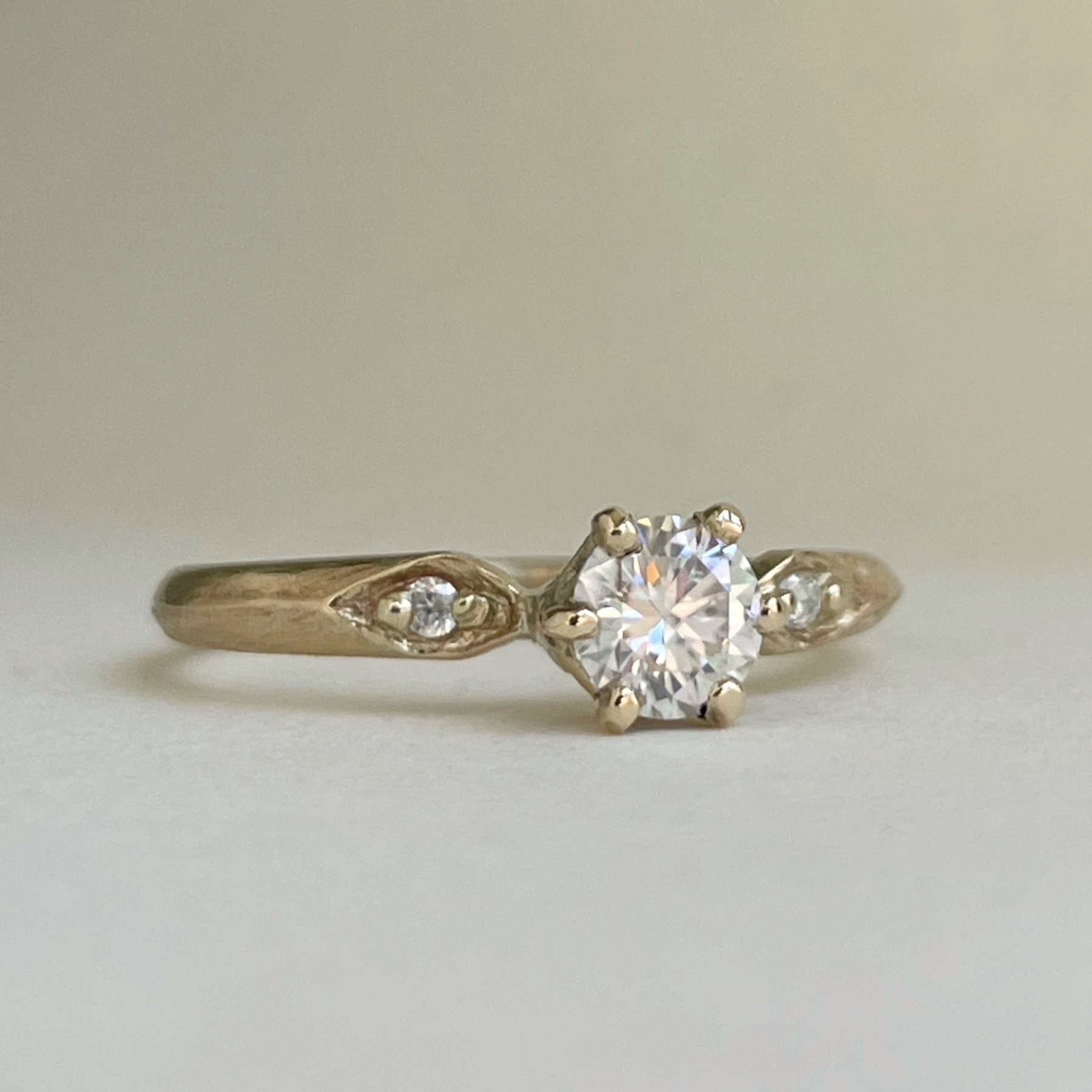 Vintage-inspired engagement ring. 10 & 14kt yellow gold, lab diamond, moissanite. Three stone gold engagement rings