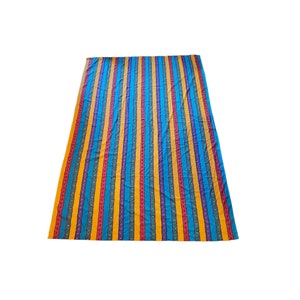 May include: A colorful striped fabric with blue, yellow, red, and purple stripes. The fabric has a subtle pattern of small flowers and leaves.