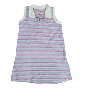 May include: Sleeveless striped dress in pink, blue, and white. The dress features a white collar and a buttoned neckline. The horizontal stripes create a classic, casual look. This dress is suitable for warm weather and everyday wear.