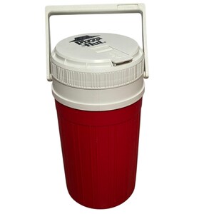 May include: A red and white plastic beverage cooler with a vertical ribbed design on the body. It features a white lid with a black Pizza Hut logo printed on top and a white swing-up handle attached to the sides for carrying the container.