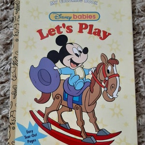 May include: A coloring book featuring Disney babies. The cover shows Mickey Mouse riding a rocking horse. The title of the book is "Let's Play".