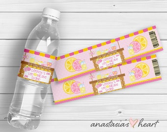 May include: Two pink and yellow lemonade stand labels with the text "Ice cold Lemonade Lennox's 25¢ Len NEaDe Stand" and a graphic of a lemonade stand with lemons and pitchers.