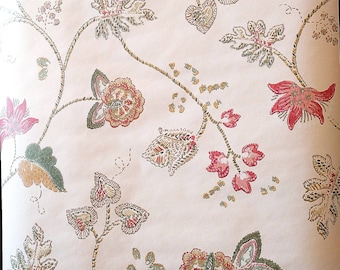 May include: A vintage wallpaper with a floral pattern. The wallpaper features a repeating design of pink and green flowers with brown stems and leaves.