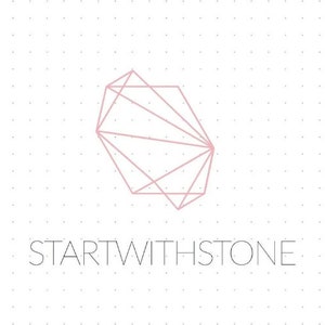 May include: A light pink geometric line art illustration of a faceted stone shape centered above the text STARTWITHSTONE in a thin, sans-serif font, all set against a white background featuring a subtle, light gray grid of evenly spaced dots.