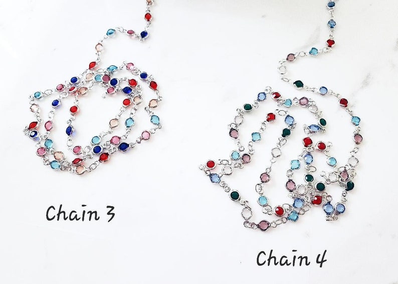 May include: Two silver-toned metal chains featuring round, multi-colored faceted stones set in individual bezels. The left chain is labeled Chain 3, and the right chain is labeled Chain 4. The stones include shades of red, blue, pink, and green.