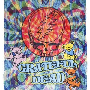 May include: A colorful psychedelic blanket featuring the Grateful Dead logo, a skull with lightning bolts, and dancing bears. The background is a swirling pattern of blue, green, yellow, and red.