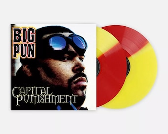 May include: A vinyl record album featuring Big Pun's "Capital Punishment." The album cover displays a portrait of Big Pun wearing sunglasses. Two vinyl records are visible, one red and yellow, the other yellow and red.