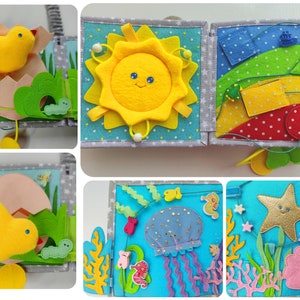 May include: A felt book for babies and toddlers with different textures and activities. The pages feature a yellow chick, a sun, a rainbow, a jellyfish, and a starfish.