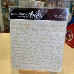 May include: A 6-inch by 6-inch stencil for crafting, featuring a handwritten script that reads "the chy dearest moment', I've you" and continues with a heartfelt message. The stencil is made of a white, semi-transparent material and is packaged in a clear plastic bag.