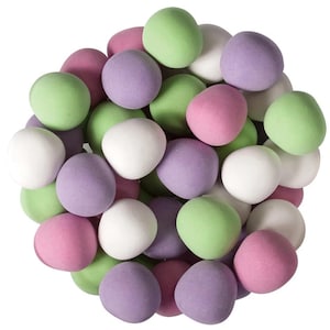 May include: A close-up shot of a pile of pastel-colored candies. The candies are round and have a matte finish. Colors include white, pink, purple, and green. The candies are clustered together, filling the frame.
