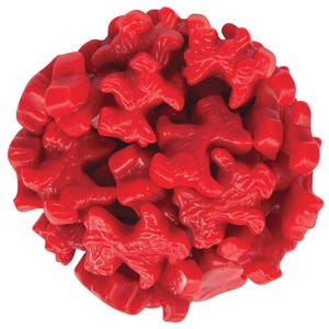 May include: A pile of bright red, gummy candies shaped like small dogs. The candies are glossy and appear to be a uniform color, with a slightly translucent quality. The image is a close-up, showing the texture and detail of the treats.