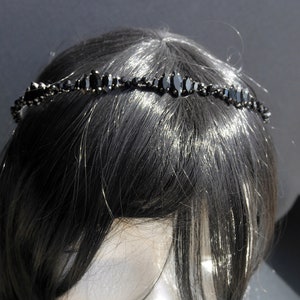 Black Wedding Hair Accessory, inspired by the desire to be different. Stand out with your own unique style on your special day with this black headband. A handmade gothic bride hair piece, black bridal or bridesmaid tiara headband, lovely for a gothic themed wedding.  

A silver toned tiara band hand wound with silver toned wire and black glass beads (6 and 4 mm) and black horse eye diamante rhinestones (15, 12 and 8 mm) for the ultimate goth bride or bridesmaid.