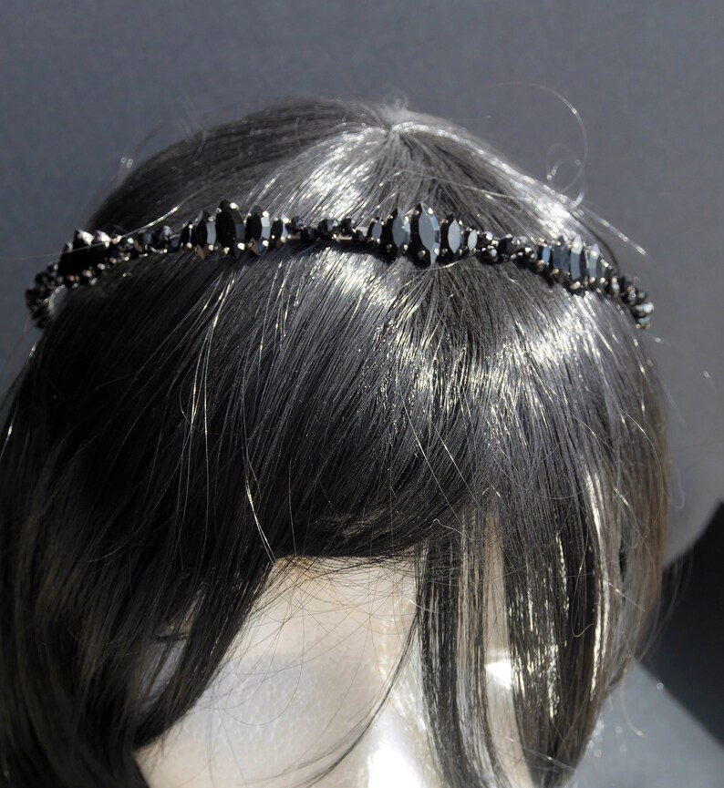 Black Wedding Hair Accessory, inspired by the desire to be different. Stand out with your own unique style on your special day with this black headband. A handmade gothic bride hair piece, black bridal or bridesmaid tiara headband, lovely for a gothic themed wedding.  

A silver toned tiara band hand wound with silver toned wire and black glass beads (6 and 4 mm) and black horse eye diamante rhinestones (15, 12 and 8 mm) for the ultimate goth bride or bridesmaid.