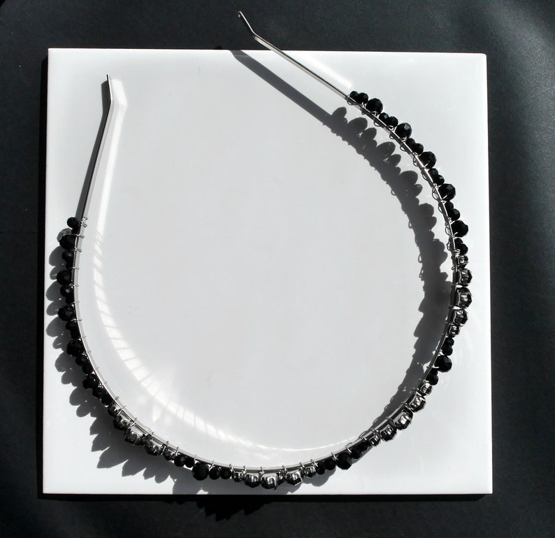 Black Wedding Hair Accessory, inspired by the desire to be different. Stand out with your own unique style on your special day with this black headband. A handmade gothic bride hair piece, black bridal or bridesmaid tiara headband, lovely for a gothic themed wedding.  

A silver toned tiara band hand wound with silver toned wire and black glass beads (6 and 4 mm) and black horse eye diamante rhinestones (15, 12 and 8 mm) for the ultimate goth bride or bridesmaid.