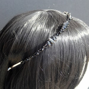 Black Wedding Hair Accessory, inspired by the desire to be different. Stand out with your own unique style on your special day with this black headband. A handmade gothic bride hair piece, black bridal or bridesmaid tiara headband, lovely for a gothic themed wedding.  

A silver toned tiara band hand wound with silver toned wire and black glass beads (6 and 4 mm) and black horse eye diamante rhinestones (15, 12 and 8 mm) for the ultimate goth bride or bridesmaid.