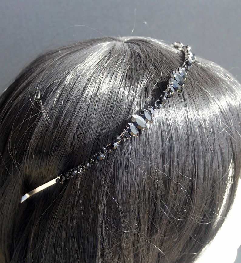 Black Wedding Hair Accessory, inspired by the desire to be different. Stand out with your own unique style on your special day with this black headband. A handmade gothic bride hair piece, black bridal or bridesmaid tiara headband, lovely for a gothic themed wedding.  

A silver toned tiara band hand wound with silver toned wire and black glass beads (6 and 4 mm) and black horse eye diamante rhinestones (15, 12 and 8 mm) for the ultimate goth bride or bridesmaid.