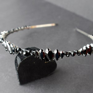 A silver toned tiara band hand wound with silver toned wire and black glass beads (6 and 4 mm) and black horse eye diamante rhinestones (15, 12 and 8 mm) for the ultimate goth bride or bridesmaid.