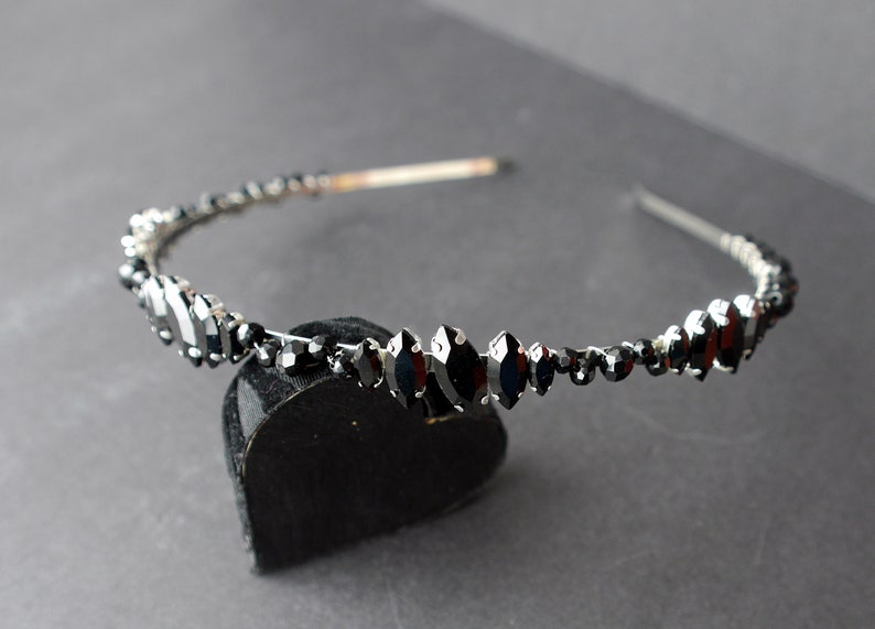 A silver toned tiara band hand wound with silver toned wire and black glass beads (6 and 4 mm) and black horse eye diamante rhinestones (15, 12 and 8 mm) for the ultimate goth bride or bridesmaid.