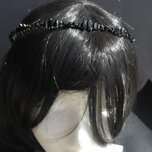 Black Wedding Hair Accessory, inspired by the desire to be different. Stand out with your own unique style on your special day with this black headband. A handmade gothic bride hair piece, black bridal or bridesmaid tiara headband, lovely for a gothic themed wedding.  

A silver toned tiara band hand wound with silver toned wire and black glass beads (6 and 4 mm) and black horse eye diamante rhinestones (15, 12 and 8 mm) for the ultimate goth bride or bridesmaid.