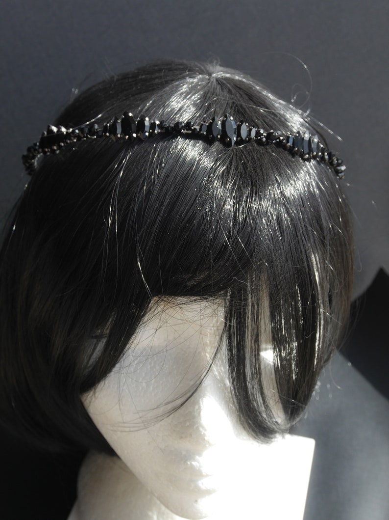 Black Wedding Hair Accessory, inspired by the desire to be different. Stand out with your own unique style on your special day with this black headband. A handmade gothic bride hair piece, black bridal or bridesmaid tiara headband, lovely for a gothic themed wedding.  

A silver toned tiara band hand wound with silver toned wire and black glass beads (6 and 4 mm) and black horse eye diamante rhinestones (15, 12 and 8 mm) for the ultimate goth bride or bridesmaid.