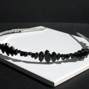 Black Wedding Hair Accessory, inspired by the desire to be different. Stand out with your own unique style on your special day with this black headband. A handmade gothic bride hair piece, black bridal or bridesmaid tiara headband, lovely for a gothic themed wedding.  

A silver toned tiara band hand wound with silver toned wire and black glass beads (6 and 4 mm) and black horse eye diamante rhinestones (15, 12 and 8 mm) for the ultimate goth bride or bridesmaid.