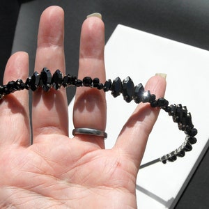 Black Wedding Hair Accessory, inspired by the desire to be different. Stand out with your own unique style on your special day with this black headband. A handmade gothic bride hair piece, black bridal or bridesmaid tiara headband, lovely for a gothic themed wedding.  

A silver toned tiara band hand wound with silver toned wire and black glass beads (6 and 4 mm) and black horse eye diamante rhinestones (15, 12 and 8 mm) for the ultimate goth bride or bridesmaid.