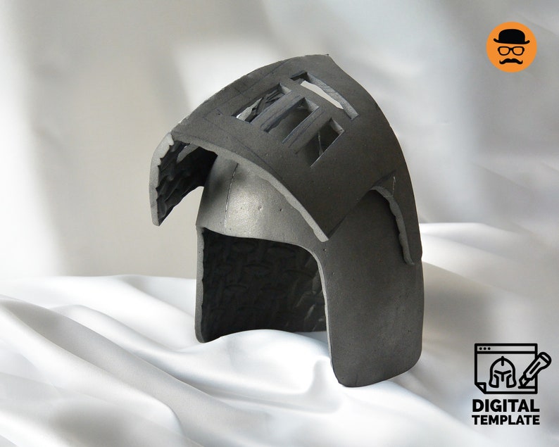May include: A dark gray helmet with a rectangular opening on top and a curved visor. The helmet is made of a textured material and sits on a white cloth. The image includes a logo that says "DIGITAL TEMPLATE".