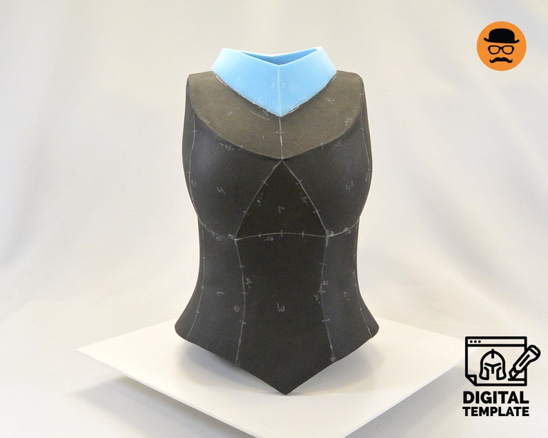 May include: A black fabric bodice with a light blue collar. The bodice is marked with lines and numbers, suggesting it is a pattern for a garment.