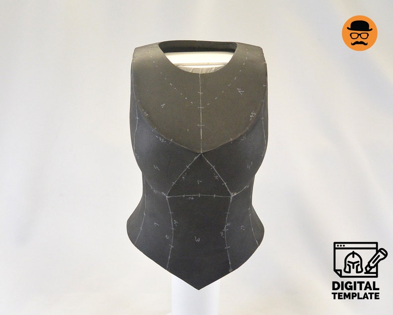 May include: A black foam template for a costume piece, with markings and lines drawn on it. The template is shaped like a vest or bodice.