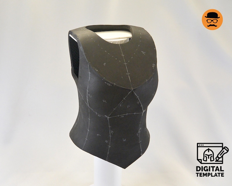 May include: A black foam armour piece with markings for sewing. The armour is shaped like a vest and has a pointed bottom.