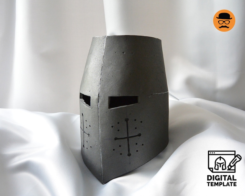 May include: A gray, medieval-style helmet with a cross design on the front. The helmet has eye slits and is made of a textured material. The image also includes a digital template logo.