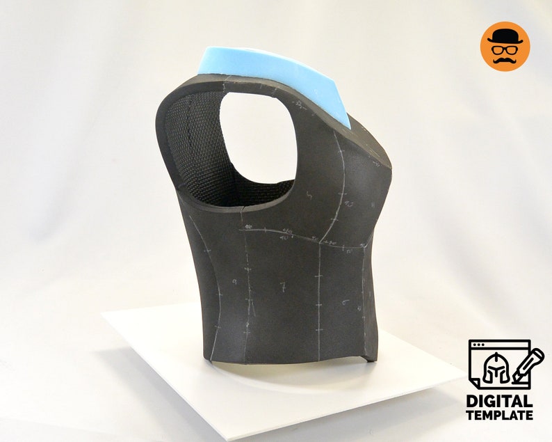 May include: A black foam vest with a light blue foam collar. The vest has markings for sewing and is on a white surface.