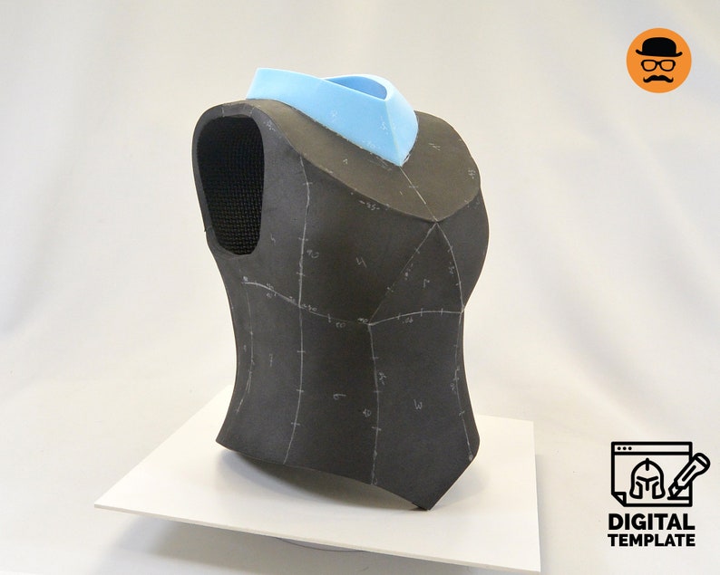 May include: A black foam mannequin torso with a blue foam neck piece. The torso is marked with lines and numbers, suggesting it is a pattern for a garment.