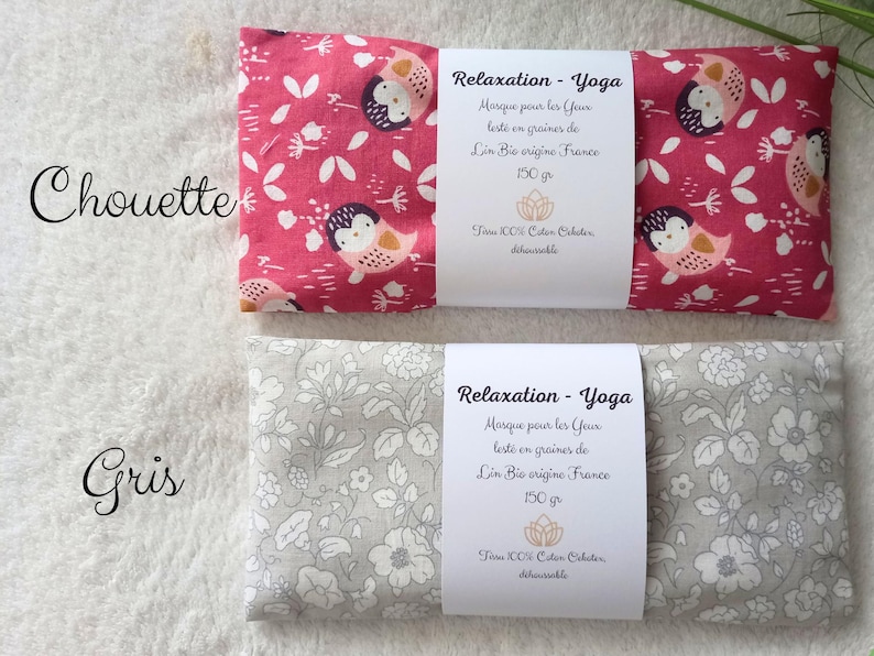 May include: Two rectangular eye masks for relaxation and yoga. One mask is pink with a white owl and leaf pattern, the other is light gray with a white floral pattern. Each features a white paper band with French text and a weight of 150 gr.