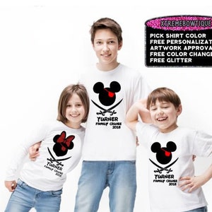 May include: Three white t-shirts with a pirate-themed Mickey Mouse design. The shirts feature a black Mickey Mouse head with a red eye patch and crossed swords. The text "TURNER FAMILY CRUISE 2018" is printed below the design.