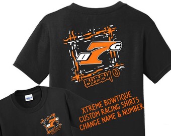 Puede incluir: Camisetas negras con un diseño de carreras. Las camisetas presentan un gráfico naranja y blanco con el texto "BOBBY O" y el texto "XTREME BOWTIQUE CUSTOM RACING SHIRTS CHANGE NAME & NUMBER".