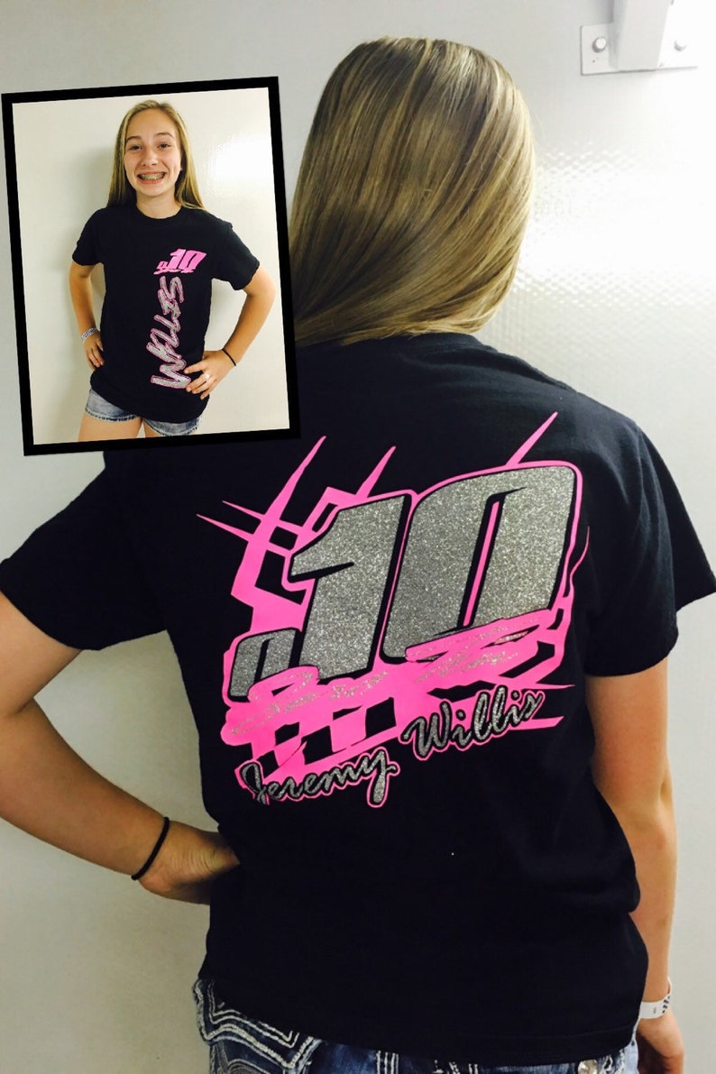 May include: Black t-shirt with a pink and silver design featuring the number "10" and the text "Jeremy Willis".