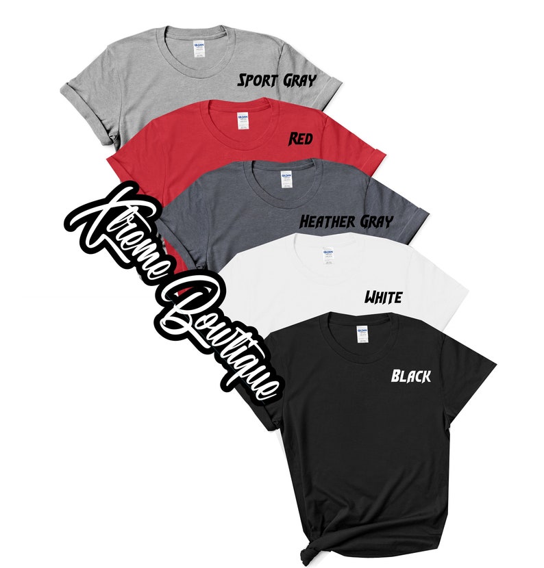May include: Five t-shirts in different colors: sport gray, red, heather gray, white, and black. Each shirt has a different color text on the front: "Sport Gray", "Red", "Heather Gray", "White", and "Black".